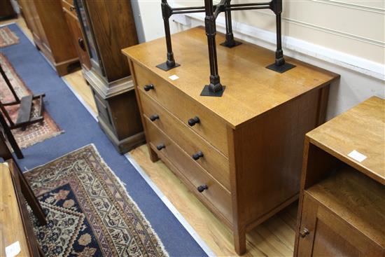 A pair of Gordon Russell oak chests, fitted with three long drawers W.99cm